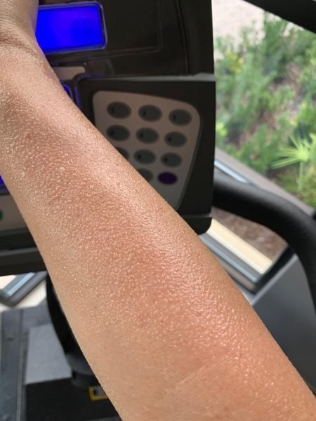 Sweaty arm on treadmill showing TNT Pro Ignite results