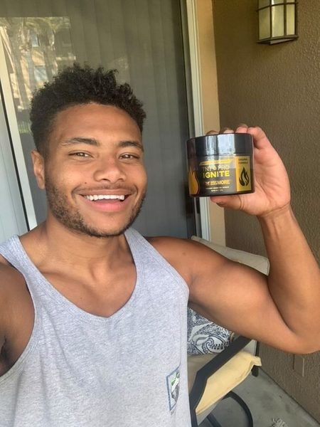 James holding TNT Pro Ignite Original Formula