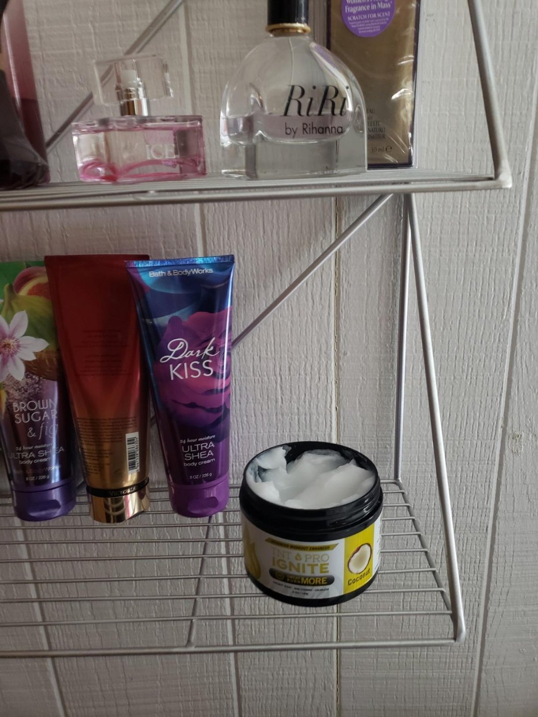 TNT Pro Ignite Coconut Sweat Cream open jar on bathroom shelf